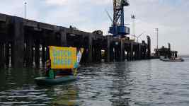 Greenpeace protesters have boarded a ship carrying diesel Volkswagens