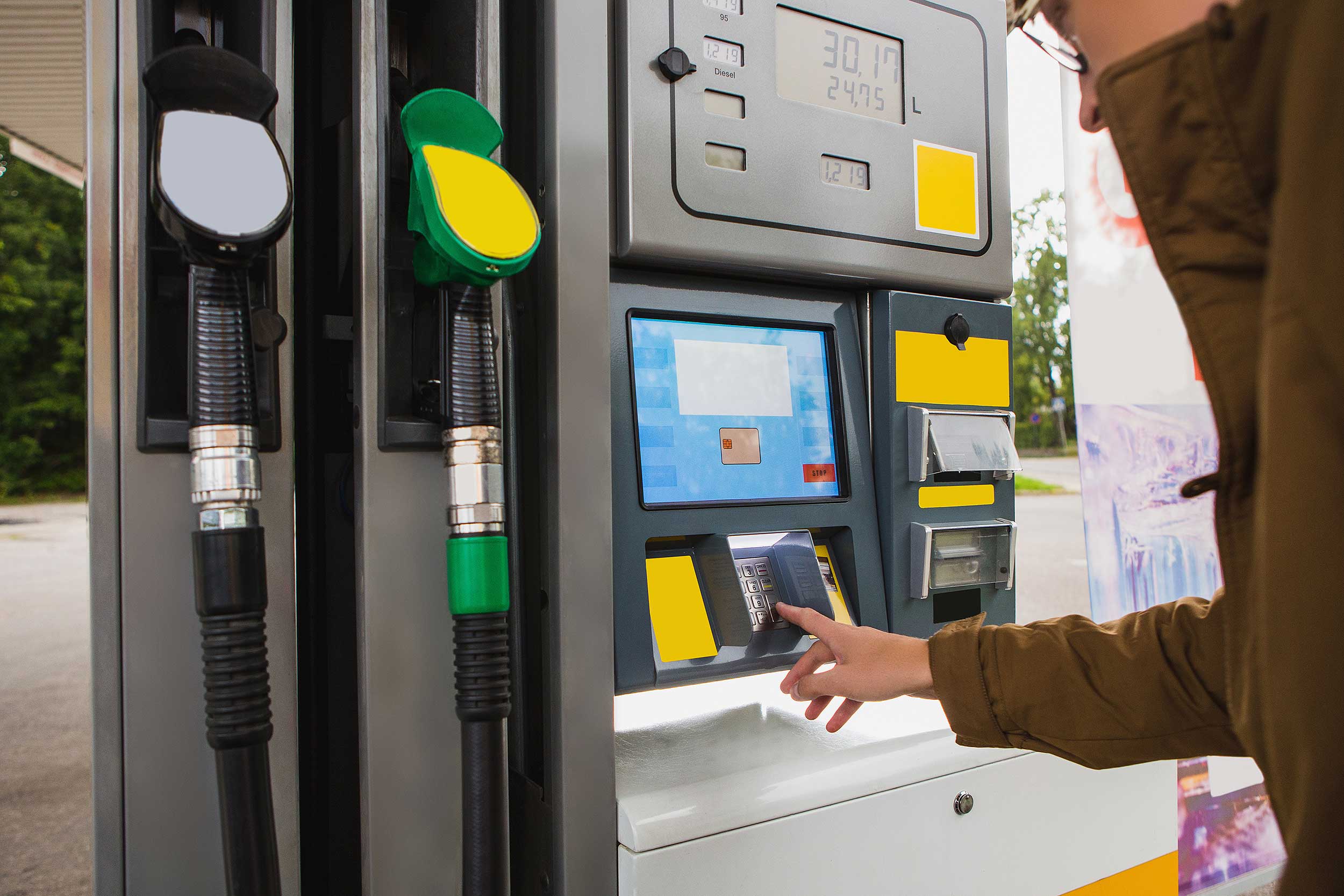 Motorist using a pay-at-pump filling station