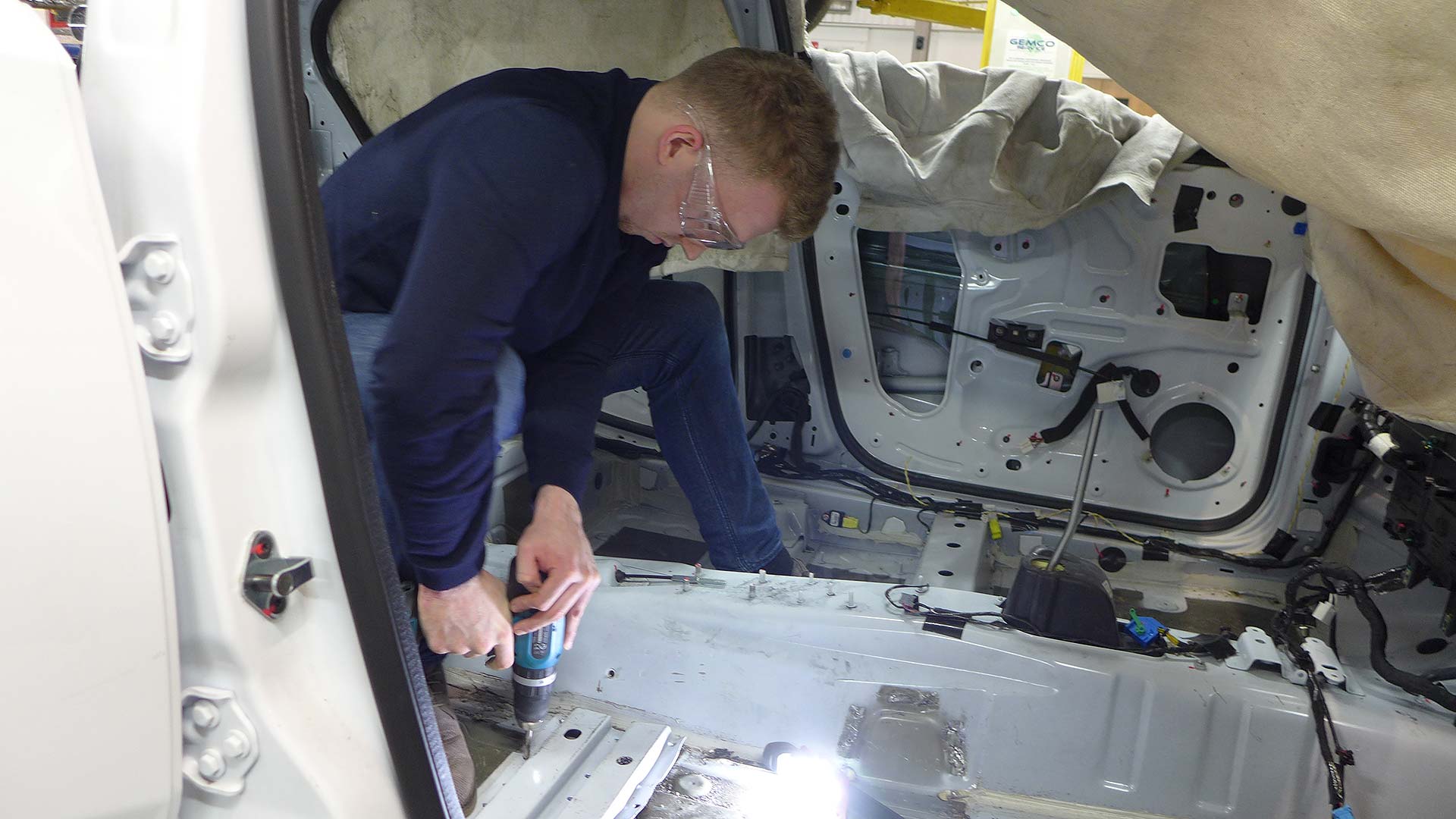 Intern working on the MG3 racing car conversion