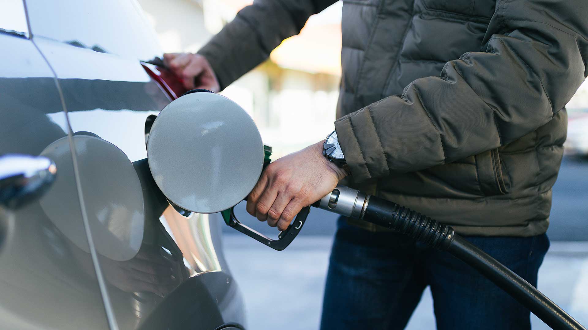 Driver filling a car with diesel fuel