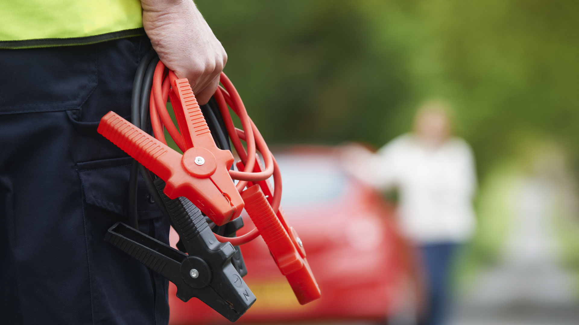 Motorist holding jump leads