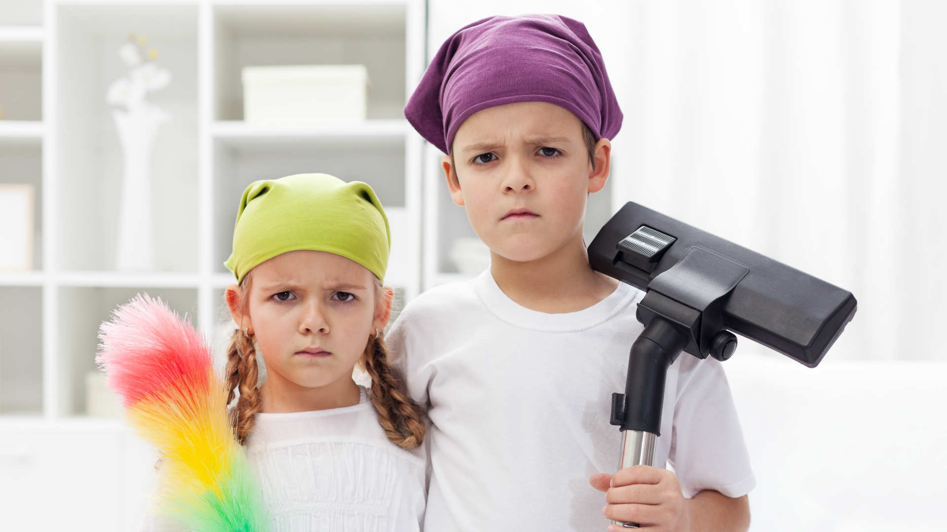 Children tidying bedroom