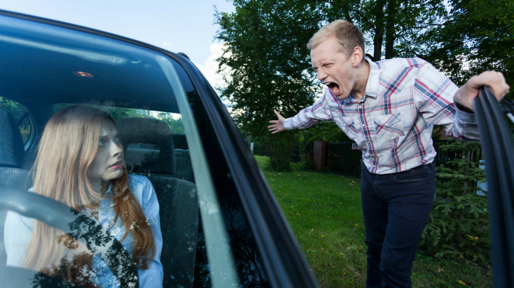 Man and woman road rage