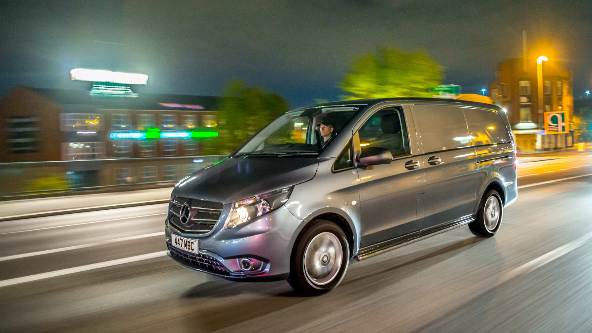 Van driver on the road at night