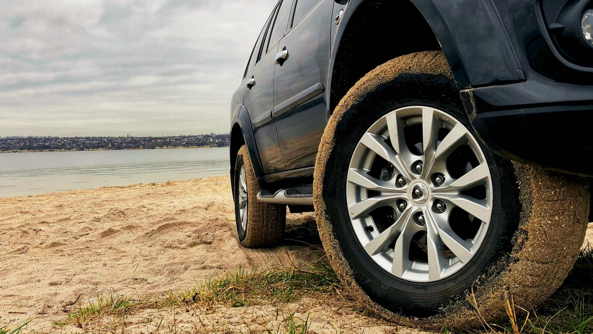 SUV tyre next to the water