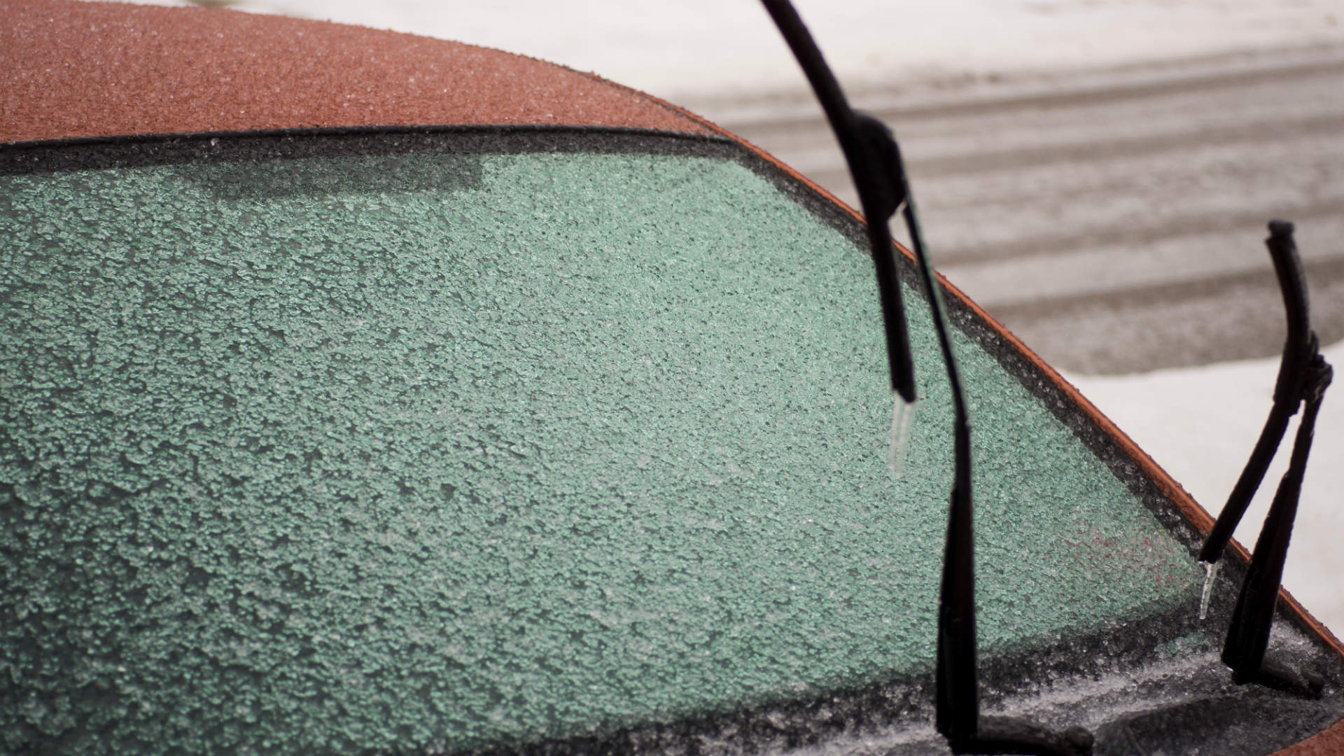 Frozen windscreen with wipers upright