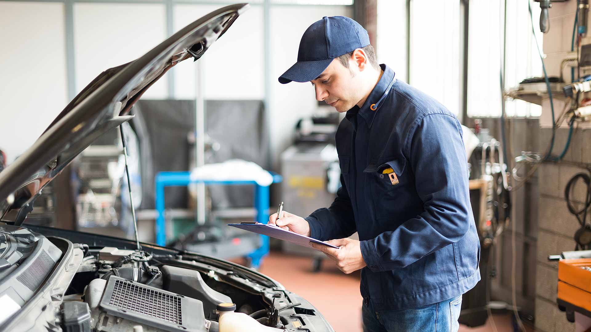 Technician carrying out a car MOT