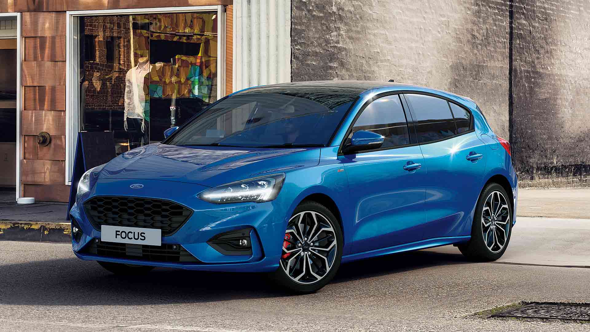 2020 Ford Focus Ecoboost Hybrid in blue pulling out of a car park