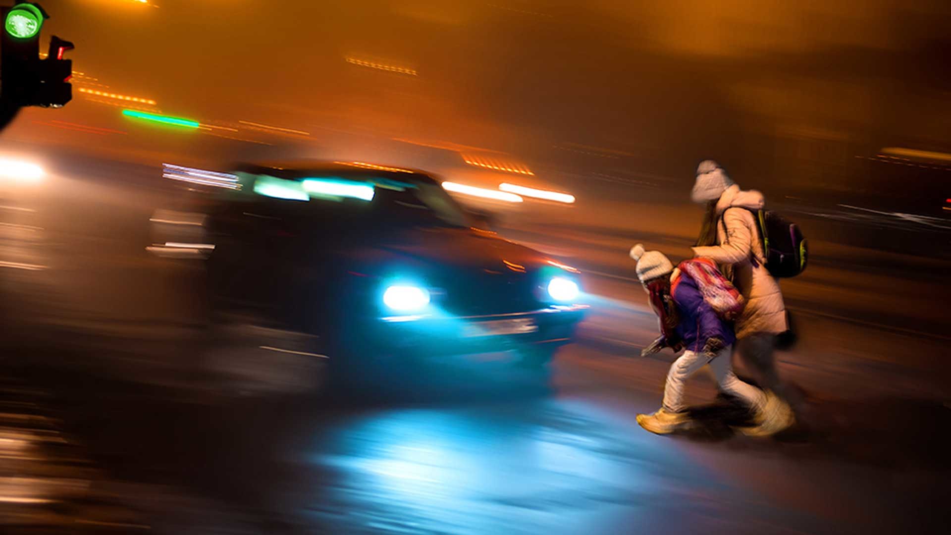 Dark roadwith child and car