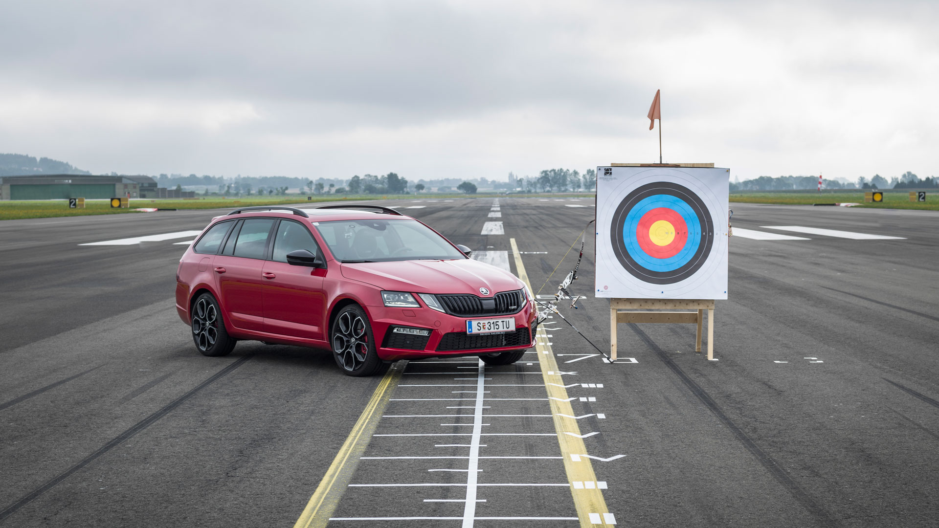 Farthest arrow fired and caught in a moving car