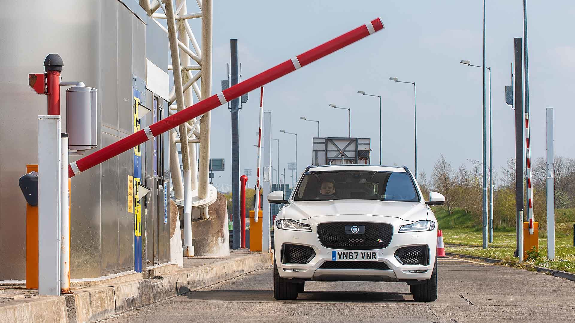 Jaguar SUV using a toll road