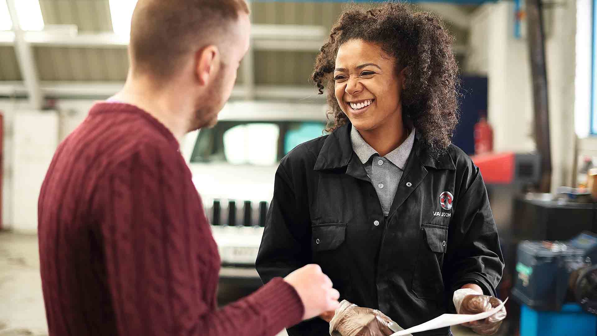 Service technician advising a motorist