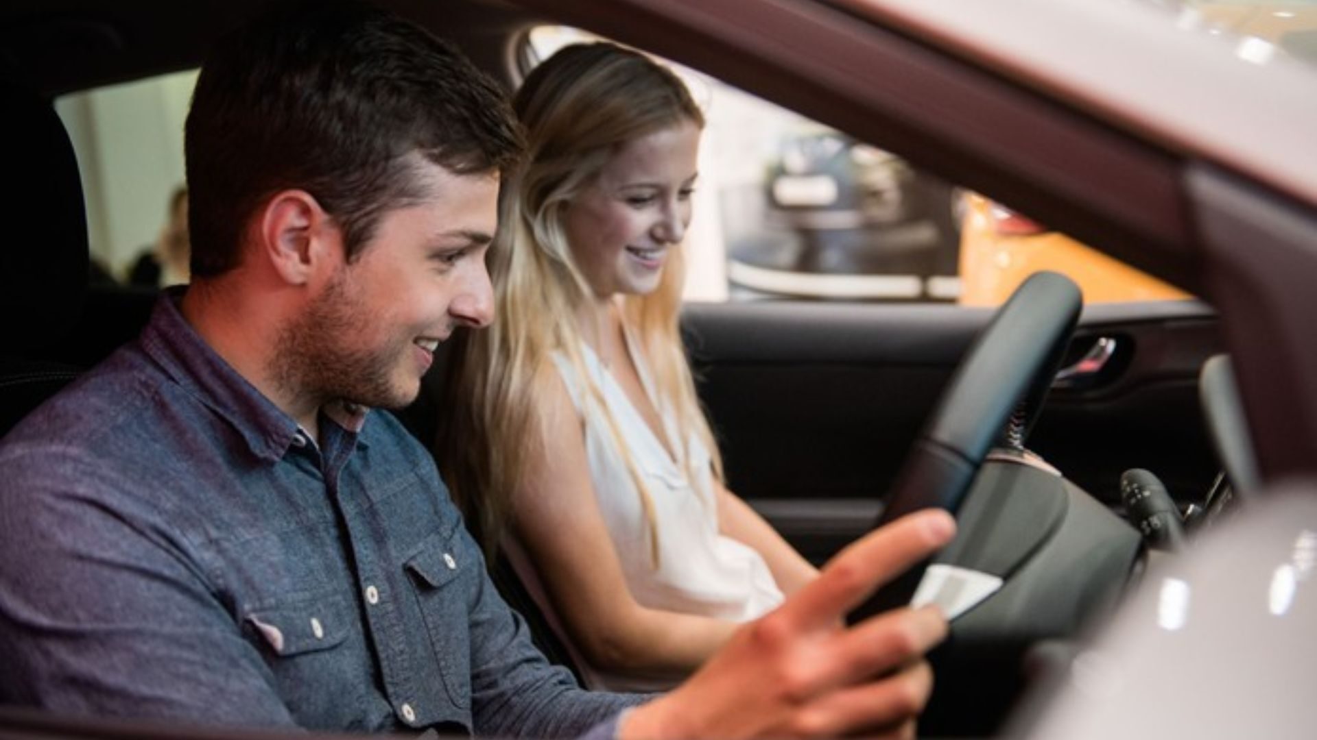 Young drivers sitting in a car